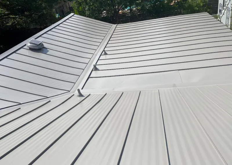 Solar attic fan installed on a metal roof for Roof Ventilation in Casper